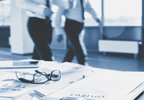 Documents and eyeglasses Business documents and eyeglasses on the desk in office